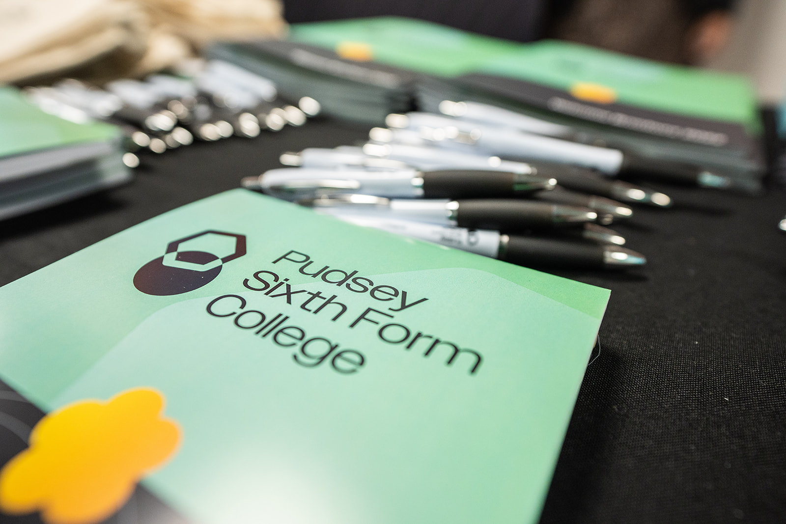 Pudsey Sixth Form College prospectus and some pens on the table