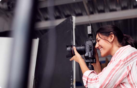 Person behind camera smiling whilst taking a picture