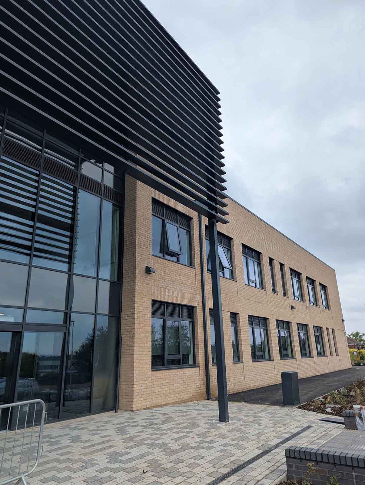 Two story brown building with brise soleil installed of Pudsey Sixth Form College