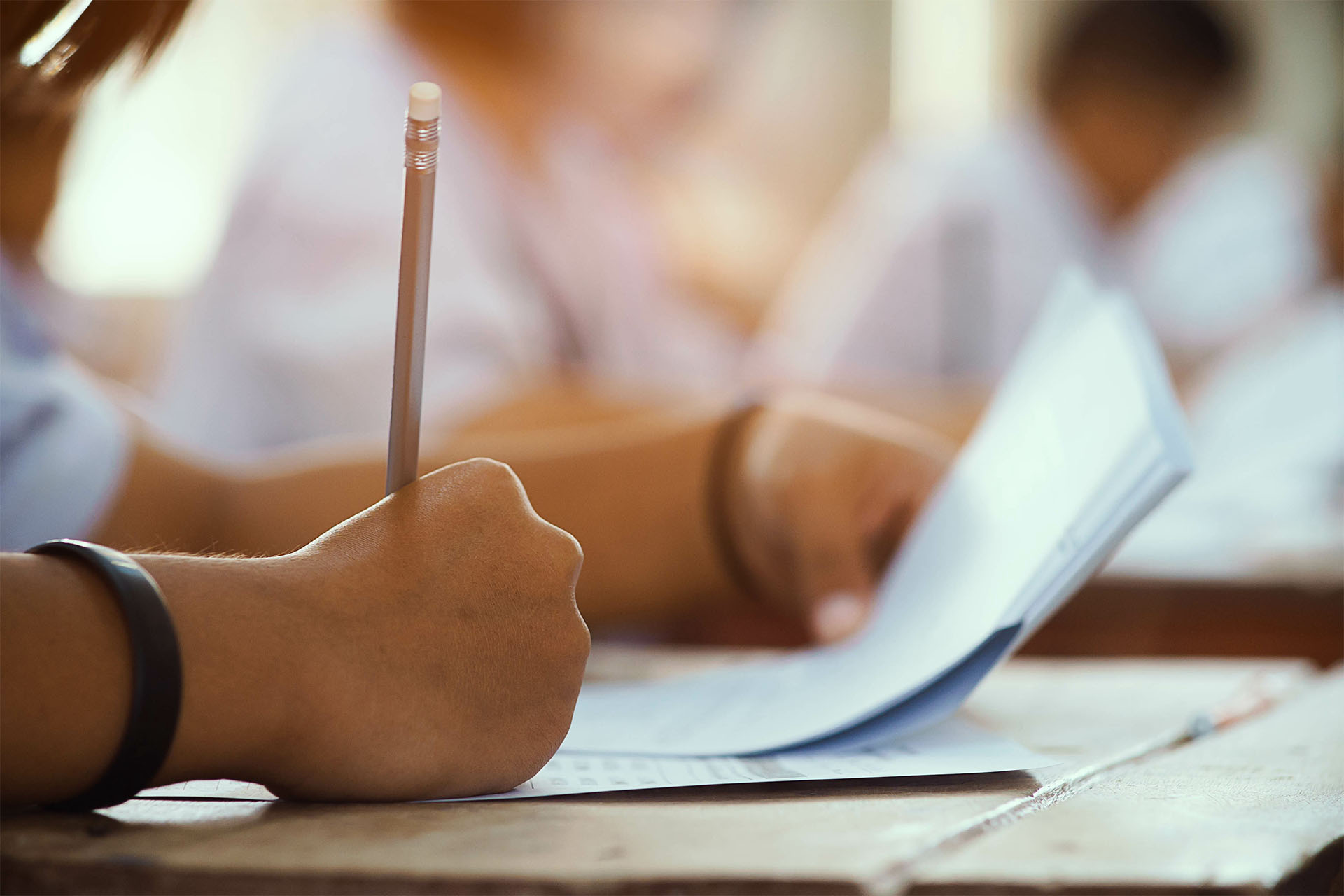 Student taking notes in the classroom