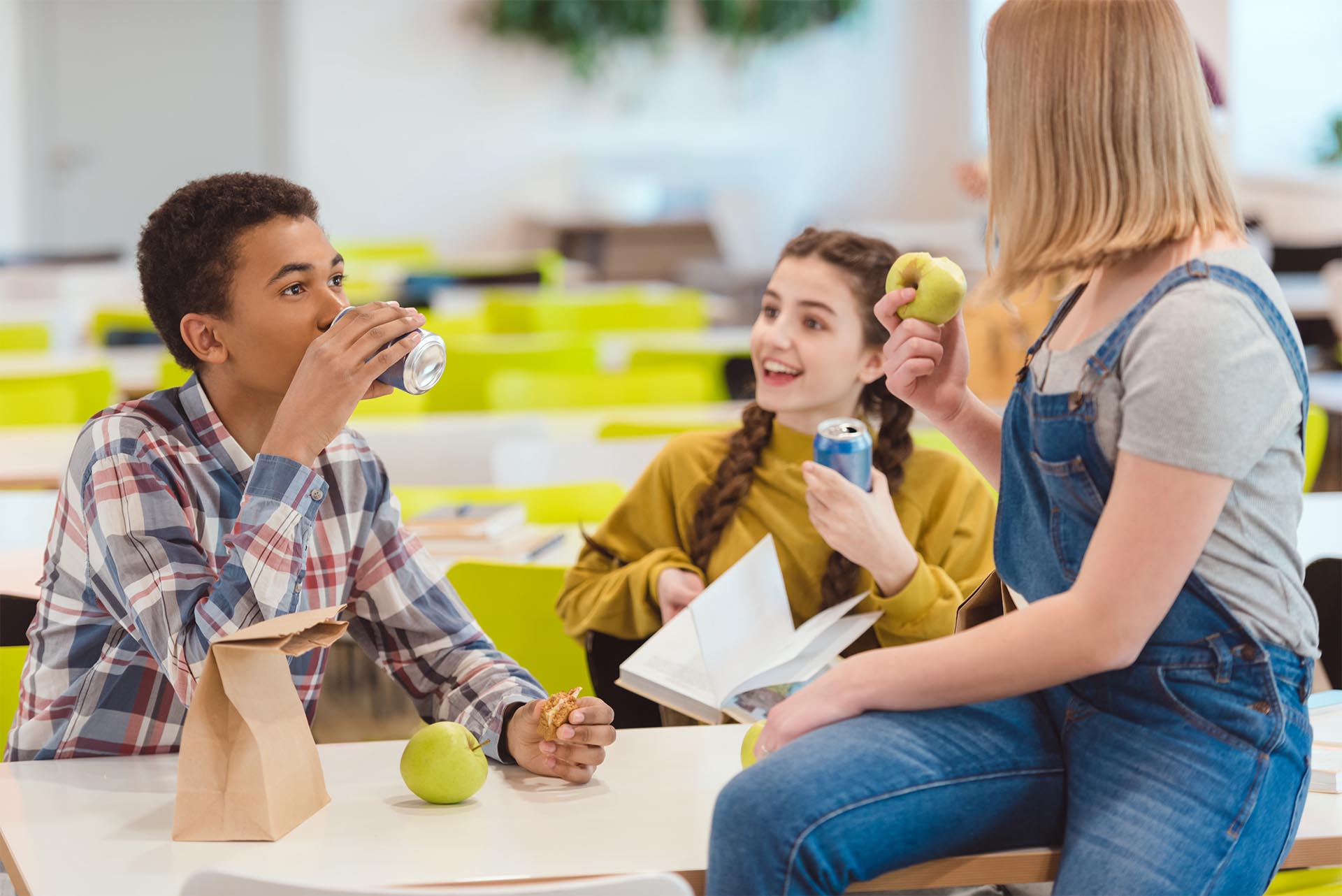 Students build relationships with their peers having cheerful conversation in the canteen