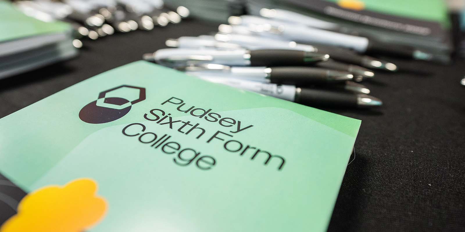 Pudsey Sixth Form College prospectus and some pens on the table