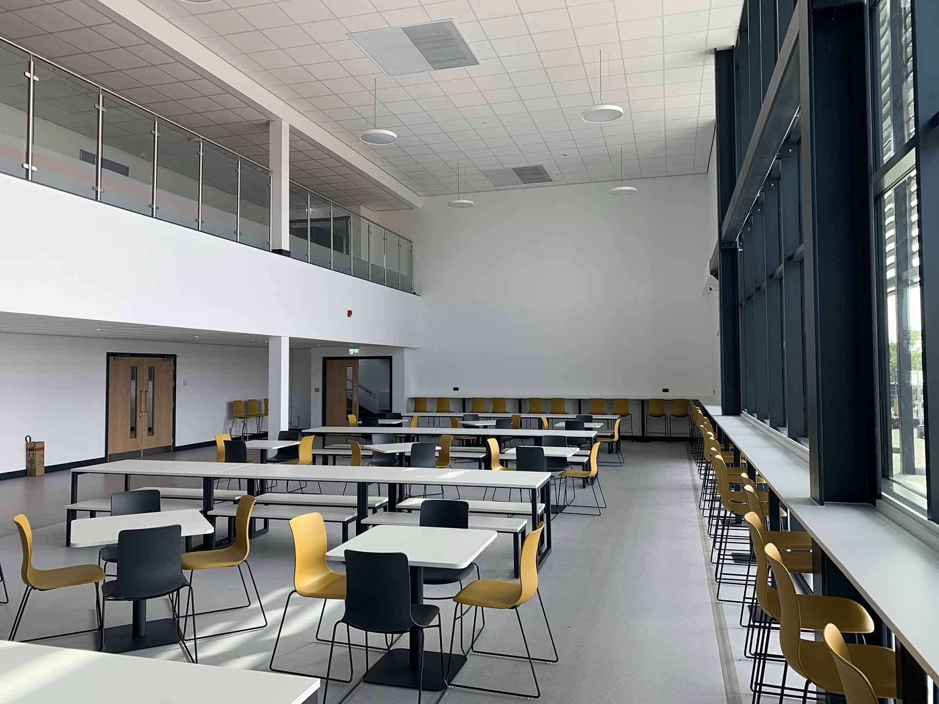Pudsey Sixth Form College interior with tables and chairs